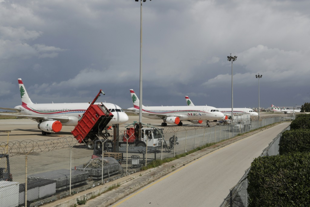 Lebanon's Middle East Airlines (MEA) planes are parked on the tarmac of Beirut International Airport amid restrictions to combat the coronavirus across the country on March 19, 2020. Lebanon urged people to stay at home for two weeks and closed the main airport to stem a novel coronavirus outbreak.