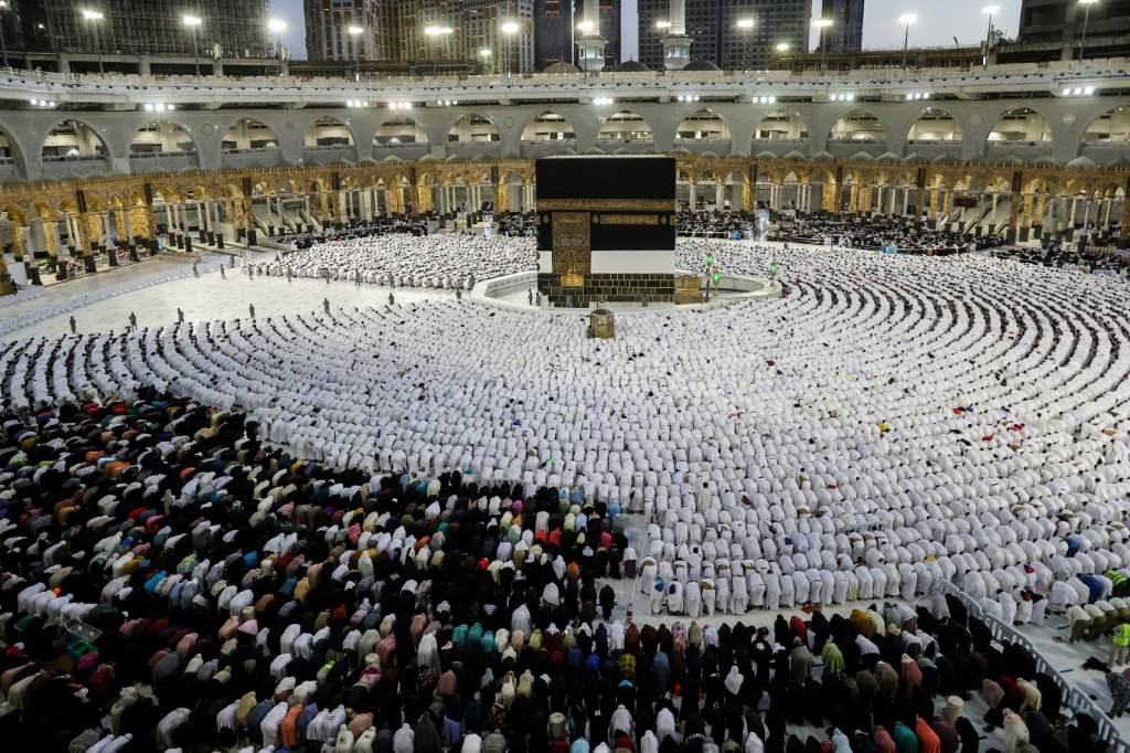 Worshippers pray around the Kaaba, Islam's holiest shrine, at the Grand Mosque in Saudi Arabia's holy city of Mecca on July 6
