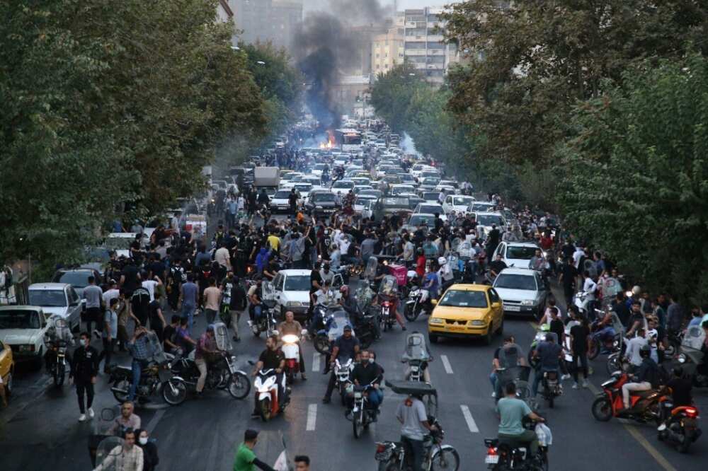 Iranian demonstrators take taking to the streets of Tehran during a protest for Mahsa Amini