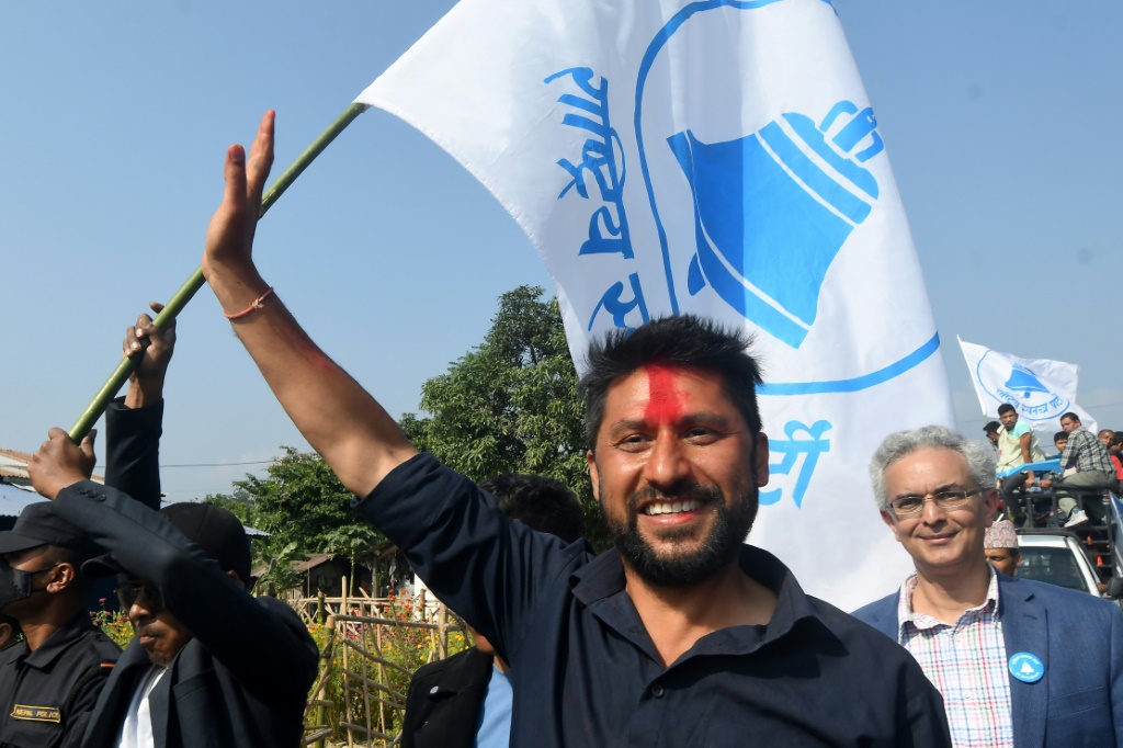 Former television host Rabi Lamichhane waves during a campaign event ahead of Nepal's general election