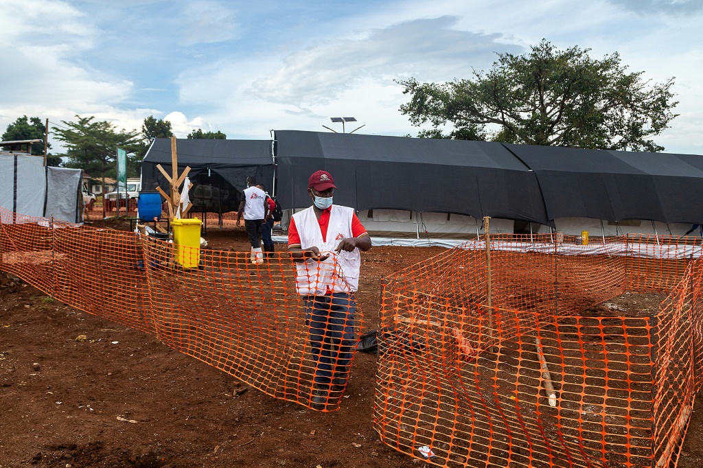Members of Doctors Without Borders set up an Ebola treatment isolation unit at the Mubende regional hospital in Uganda amid an outbreak of of the deadly disease