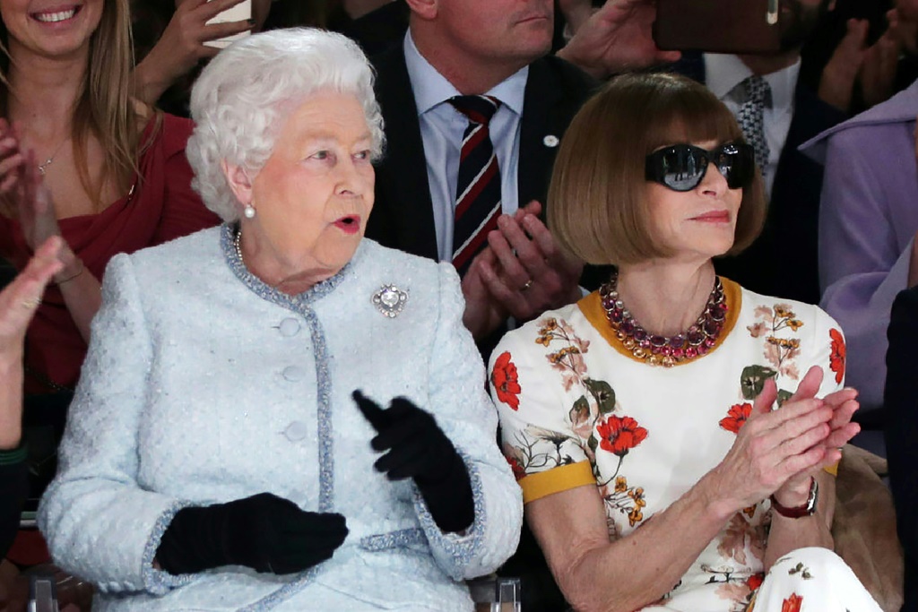 Queen Elizabeth II sits next to Vogue editor in chief Anna Wintour at London Fashion Week on February 20, 2018