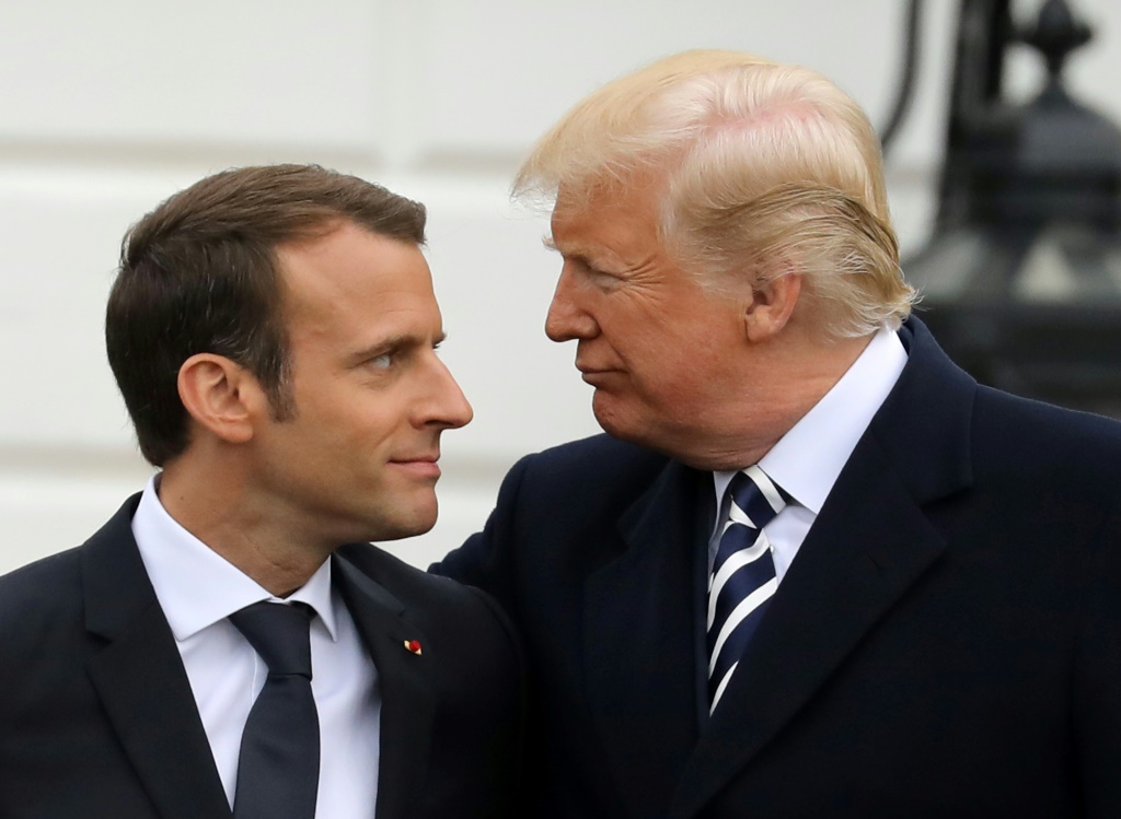 Macron tried to woo Biden's predecessor Donald Trump (R) early in his term