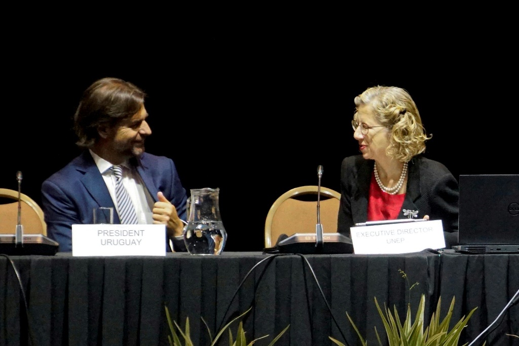 Uruguay's President Luis Lacalle Pou speaks with the Executive Director of the UN Environment Programme, Inger Andersen, at the opening of talks to establish a global plastics treaty