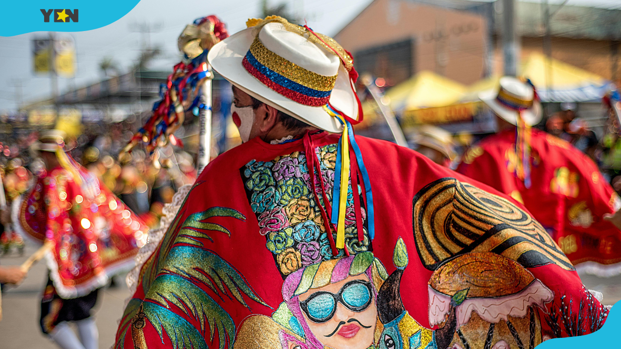 Dancers in colourful clothes dancing on a parade during a festival in Colombia