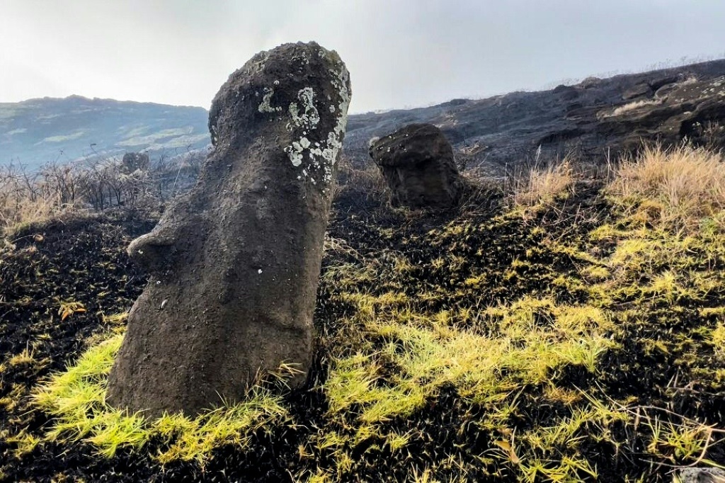 This handout picture released by the Rapa Nui municipality shows moai -- stone statues of the Rapa Nui culture -- affected by a fire at the Rapa Nui National Park on Easter Island, Chile