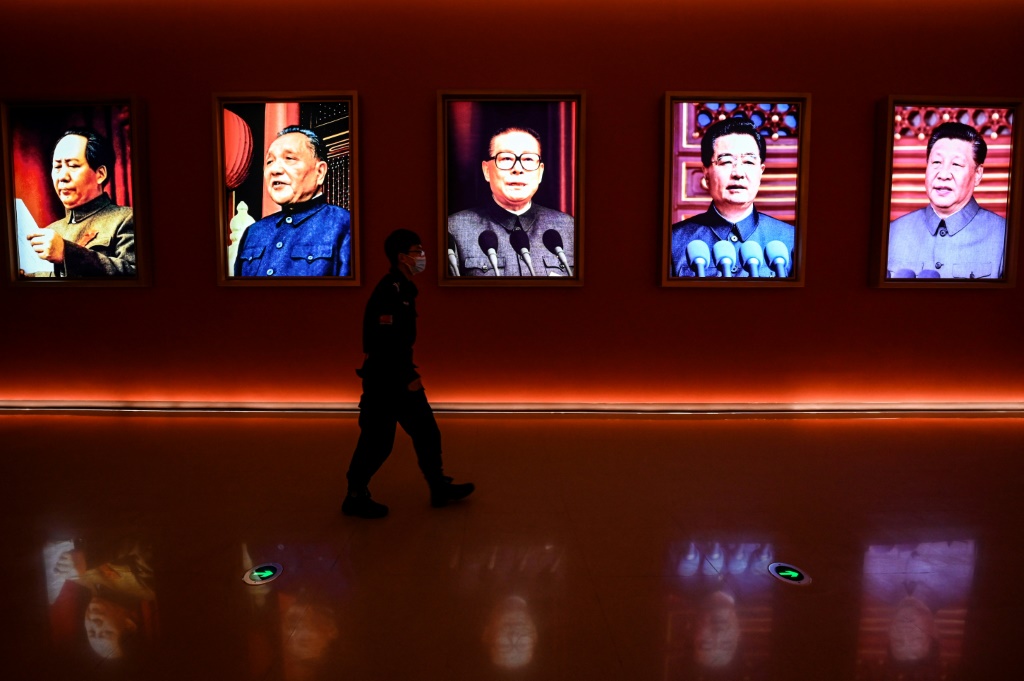 Portraits of (L to R) late Chinese chairman Mao Zedong, former leaders Deng Xiaoping, Jiang Zemin and Hu Jintao, and current President Xi Jinping decorate Yan'an Revolutionary Memorial Hall in Yan'an city ahead of the 20th Communist Party Congress