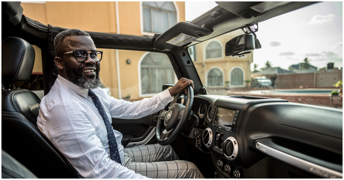 Sammy Kuffuor takes a ride in his exotic car in front of his house