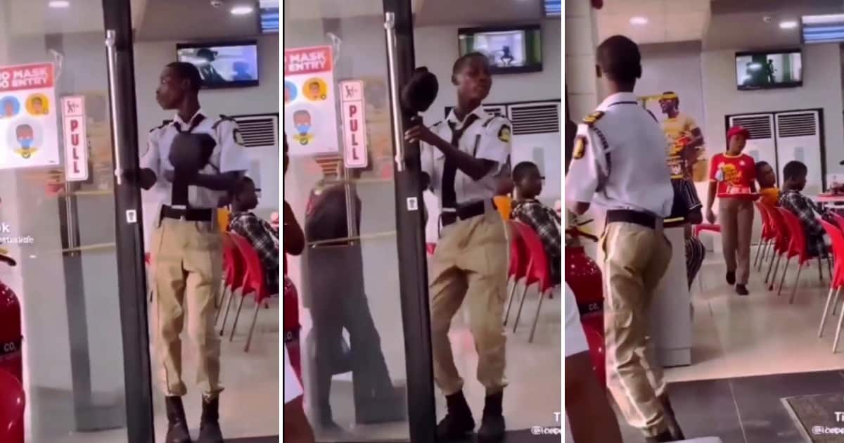 A security guard danced while opening a door.