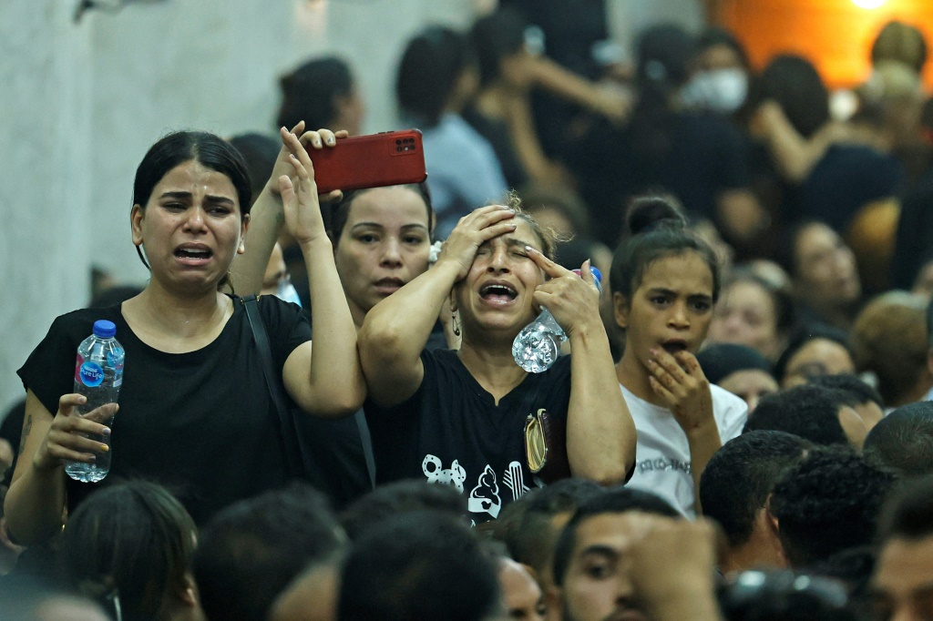 Egyptian mourners at the funeral of victims killed in the Coptic church fire, at the Church of the Blessed Virgin Mary in Imbaba district in the west of greater Cairo