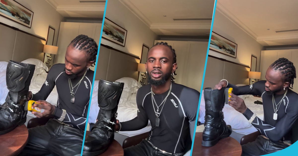 Black Sherif polishes his giant black boots, video gets many laughing hard: "The latest shoeshiner"