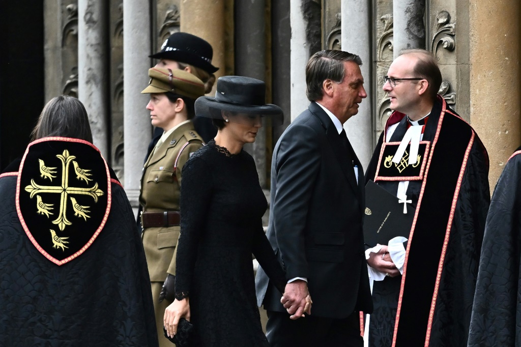 Brazil's President Jair Bolsonaro and his wife Michelle Bolsonaro arrive at Westminster Abbey in London on September 19, 2022, for the State Funeral Service for Britain's Queen Elizabeth II