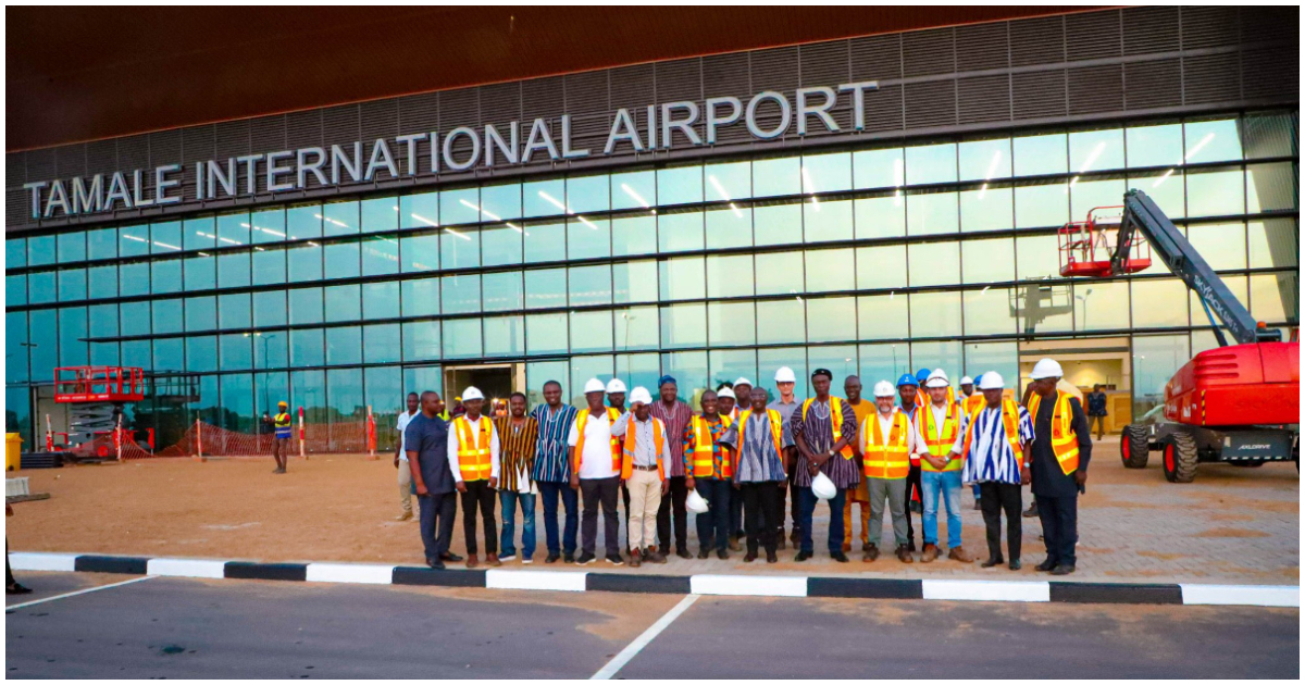 Construction workers pose with Vice-President of Ghana, Mahamudu Bawumia infront of the Tamale International Airport
