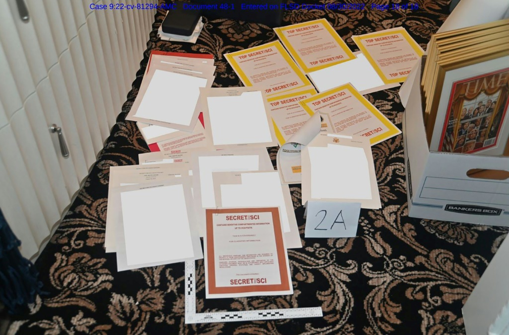 This undated file photo released by the US Department of Justice on August 31, 2022 shows a photo of documents allegedly seized at Donald Trump's Mar-a-Lago resort spread over a carpet