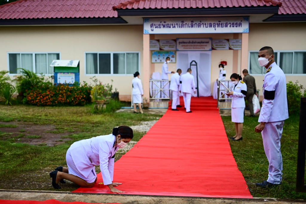 Officials prepare a red carpet in Nong Bua Lam Phu province ahead of the arrival of Thailand's King Maha Vajiralongkorn