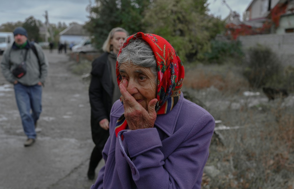 A weeping woman in Mykolaiv, Ukraine, on October 23, 2022