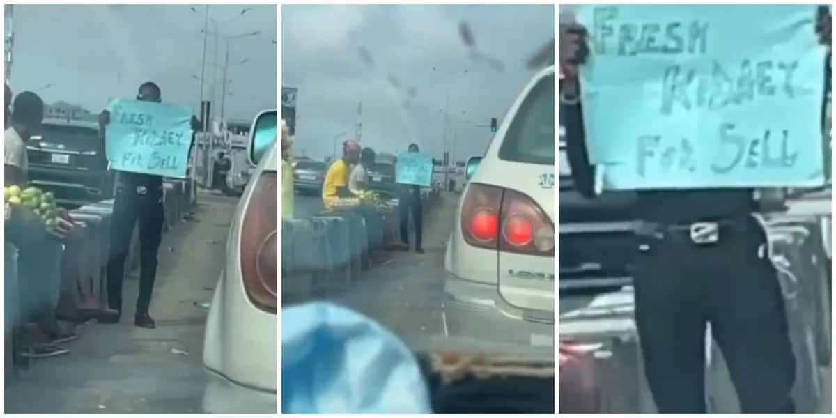 Reactions as Nigerian man hits busy road with cardboard as he puts his kidney up for sale