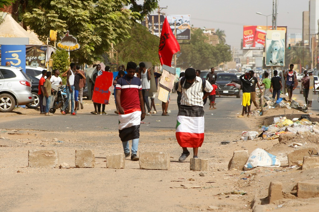 Raising Sudanese flags and posters of activists killed during previous pro-democracy protests, demonstrators tried to march on the presidential palace in central Khartoum
