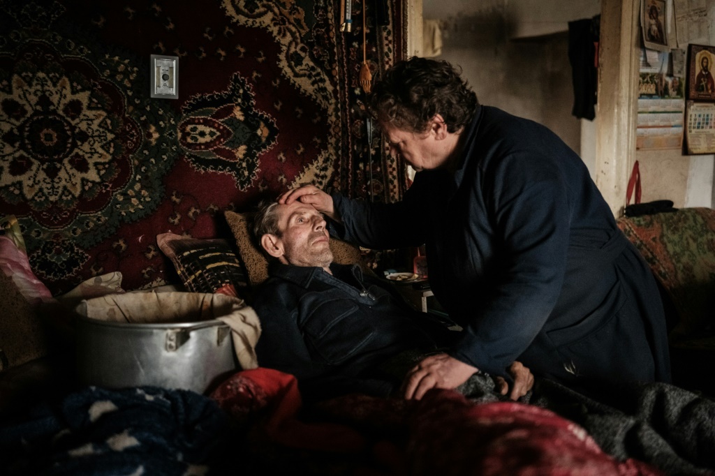 Oleksandra fears her husband Mykola, who has cancer, will die before they are able to leave their leaking house in the frontline Ukraine town of Bakhmut