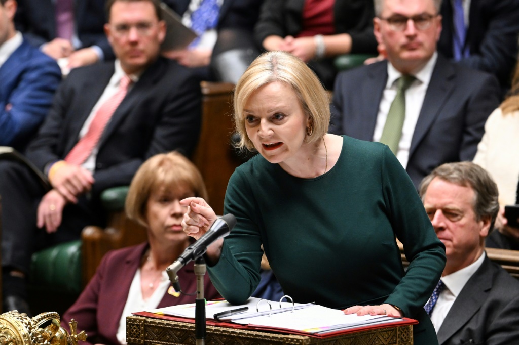 A handout photograph released by the UK Parliament shows Britain's Prime Minister Liz Truss gesturing and speaking during the Prime Minister's Questions (PMQ's) at the House of Commons, in London, on October 12, 2022.