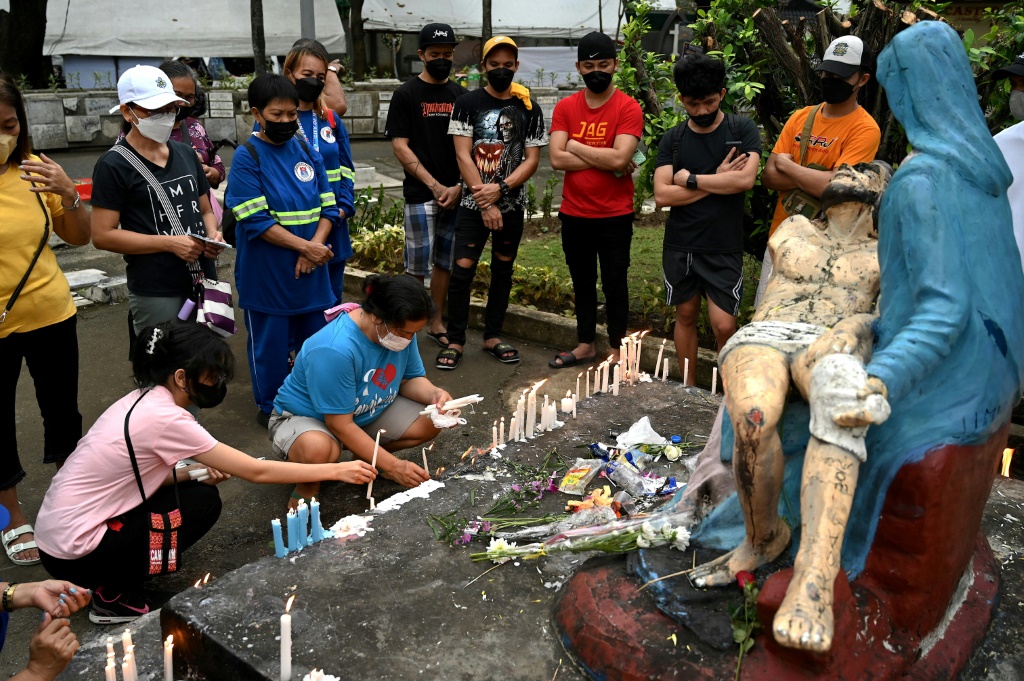 Millions of Filipinos normally go to cemeteries on the day to remember their dead relatives by praying, lighting candles and leaving flowers at the gravesites