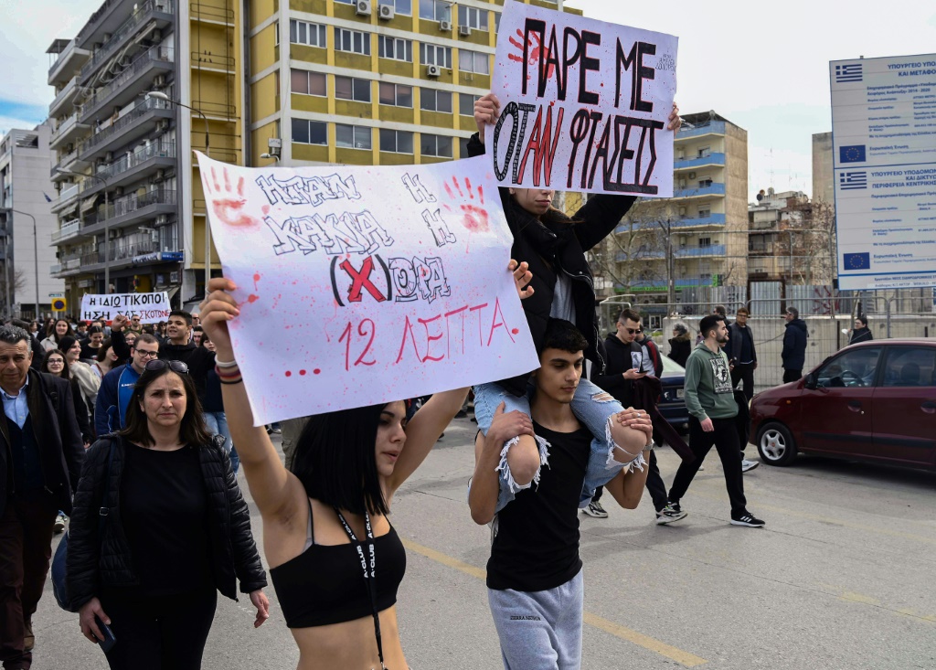 Protesters march in Greece during demonstrations over the country's worst rail tragedy