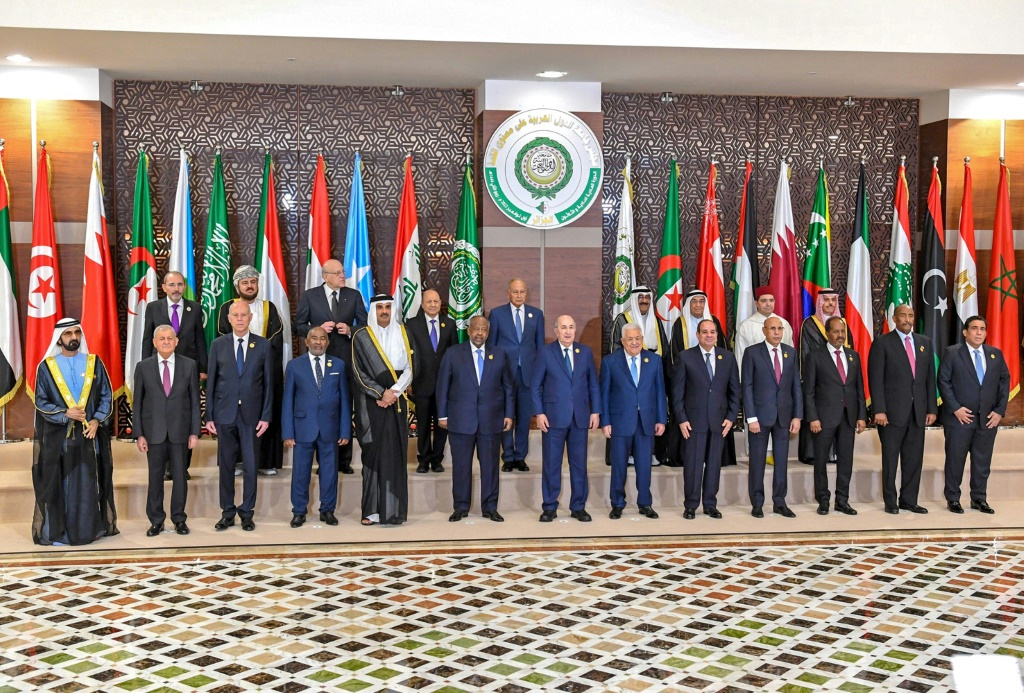 A handout picture provided by the Tunisian presidency press service shows Arab League leaders posing in the Algerian capital following their first summit since a string of normalisation deals with Israel