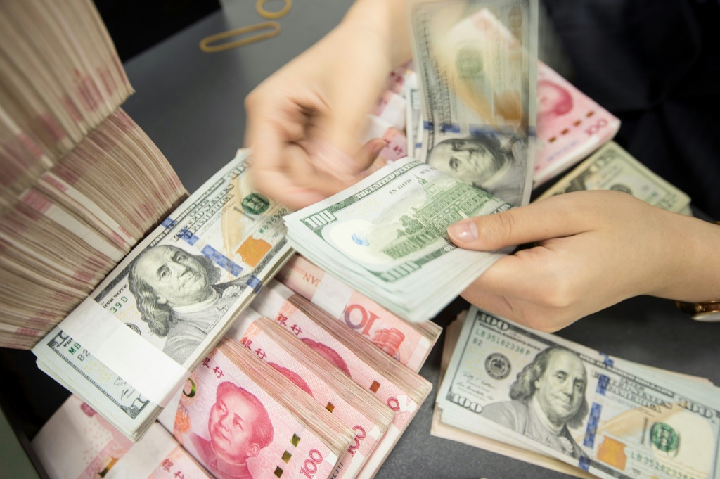 The offshore yuan has hit its lowest level against the dollar on record