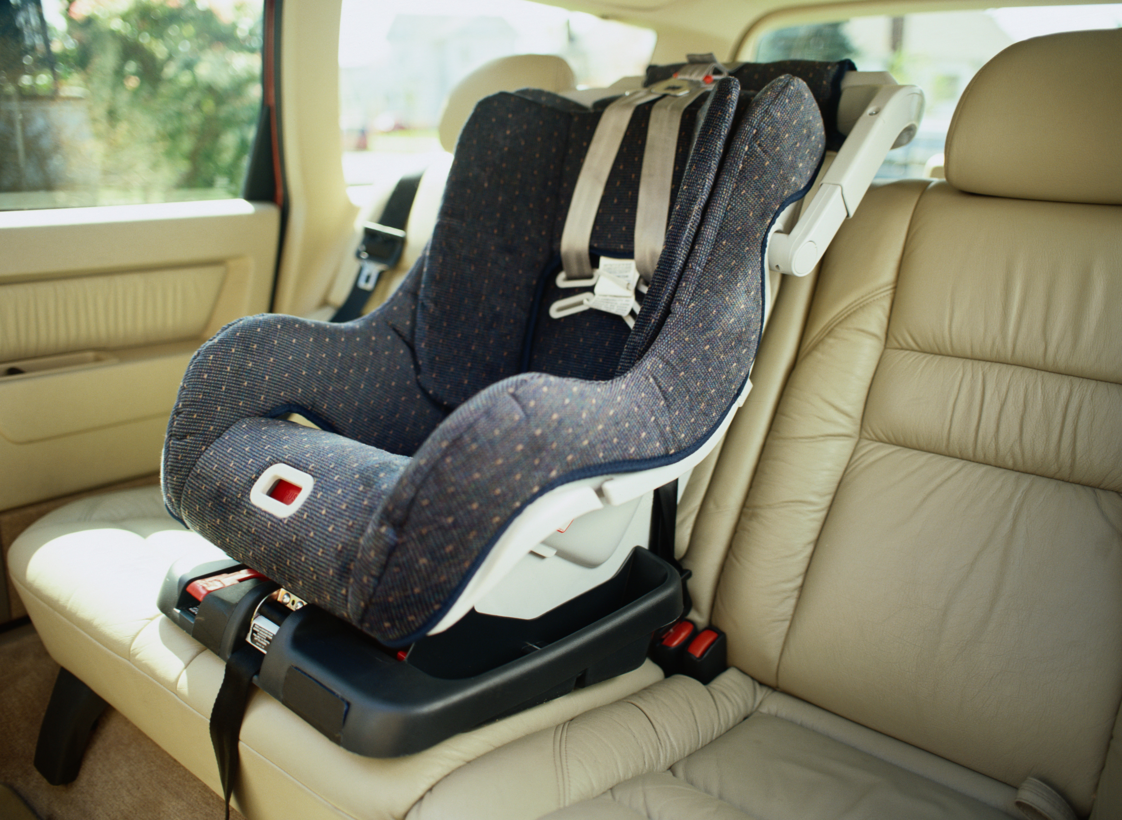 A baby seat is at the centre of the back car seat