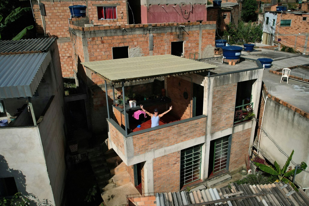 Dos Anjos is seen on the terrace of his prize-winning house in a Brazilian favela on February 24, 2023