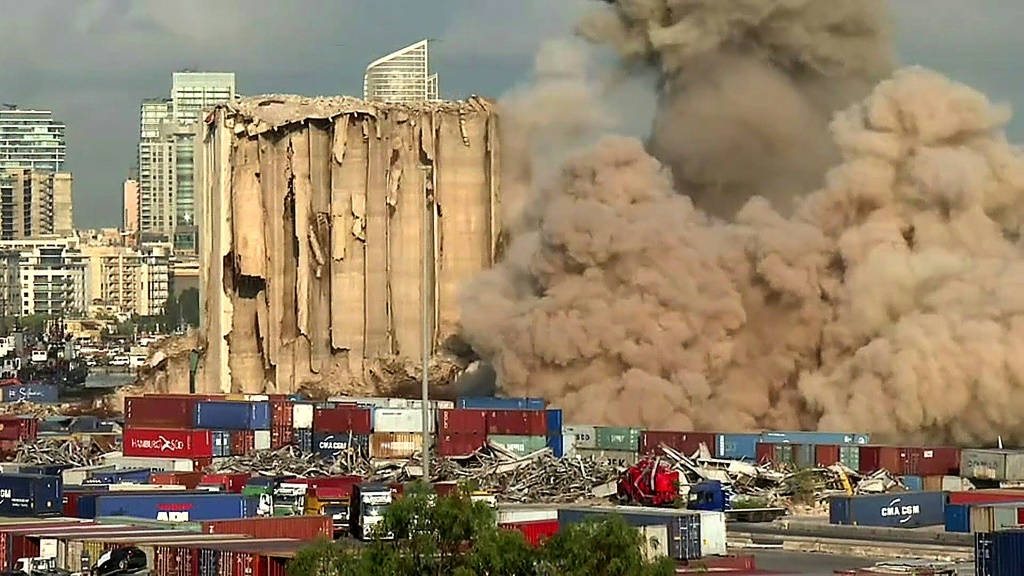 This grab from AFPTV footage shows a massive plume of smoke rising over Beirut port after the collapse of eight more grain silos damaged in a devastating 2020 explosion