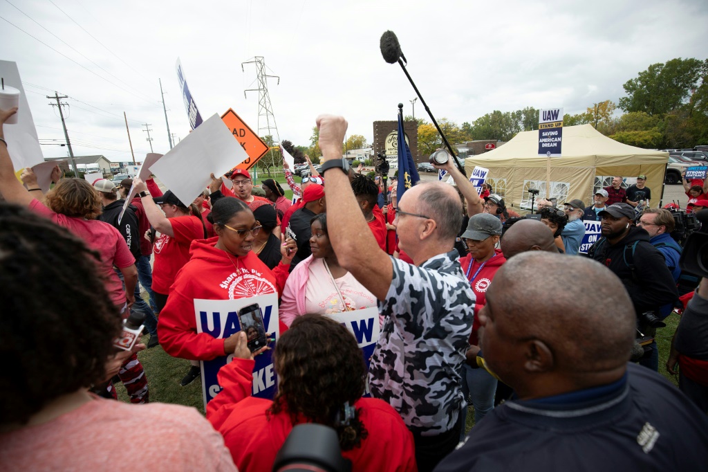 UAW President Shawn Fain joining workers on the picket line late last month in Lansing, Michigan