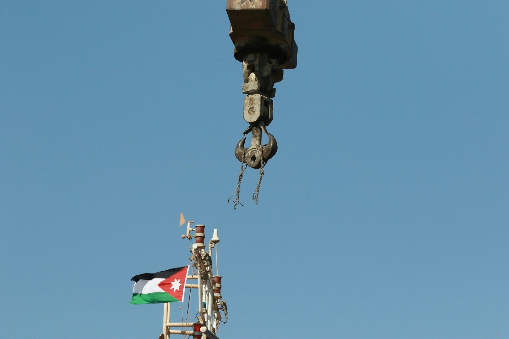 The remains of the snapped cable still hang from the crane after Monday's accident on the dockside in Aqaba