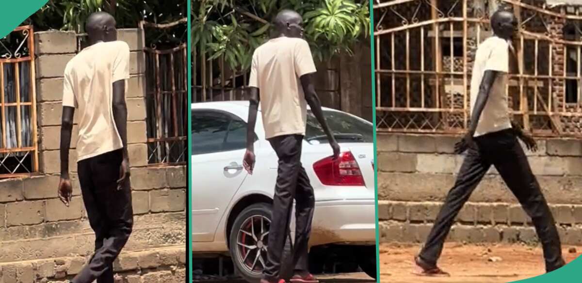 Tall man attracts public attention while walking on street road: "A true giant of Africa"