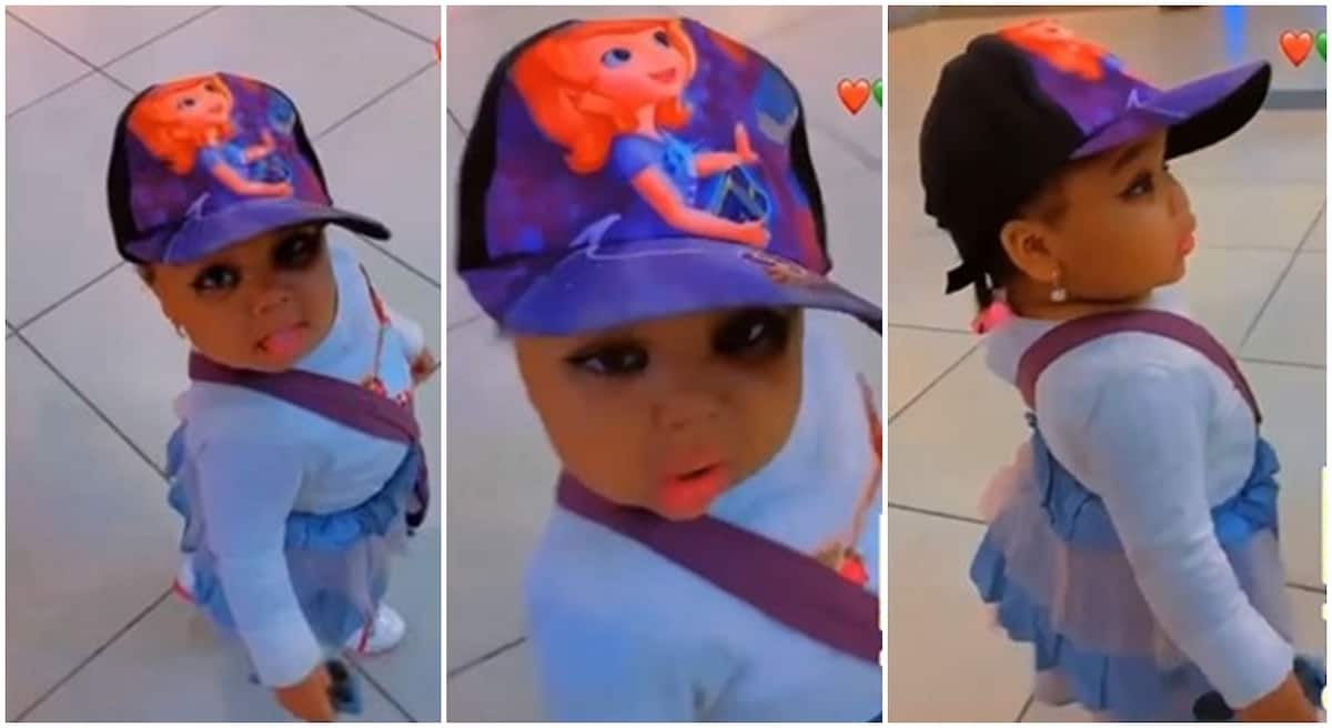 Little girl in fez cap