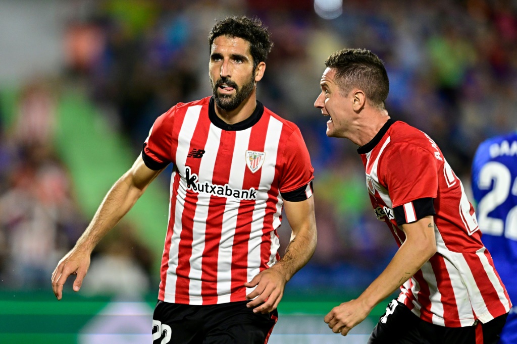 Athletic Bilbao's Raul Garcia (L) says he is 'glad' that the Spanish government is raising his taxes as part of a new 'solidarity' tax to help the less well off