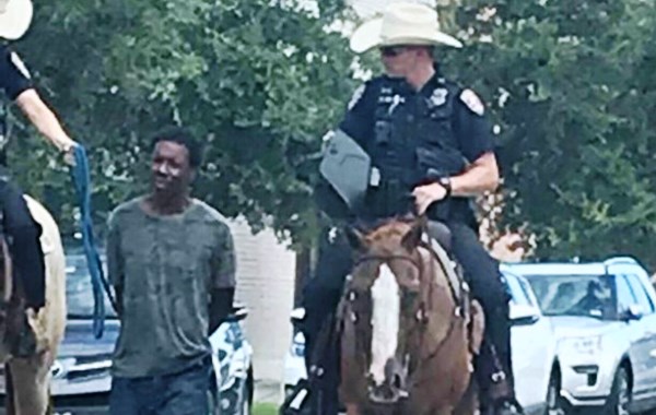 Police boss apologises after officers on horseback parade tied up suspect through town