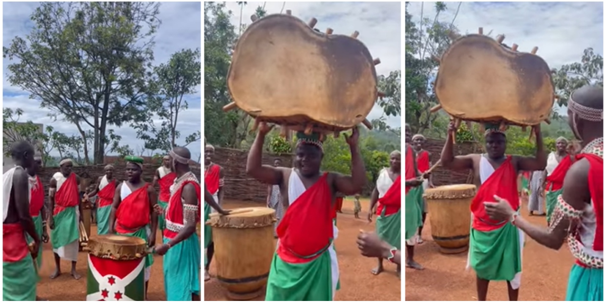 Wode Maya carries drum in Burundi