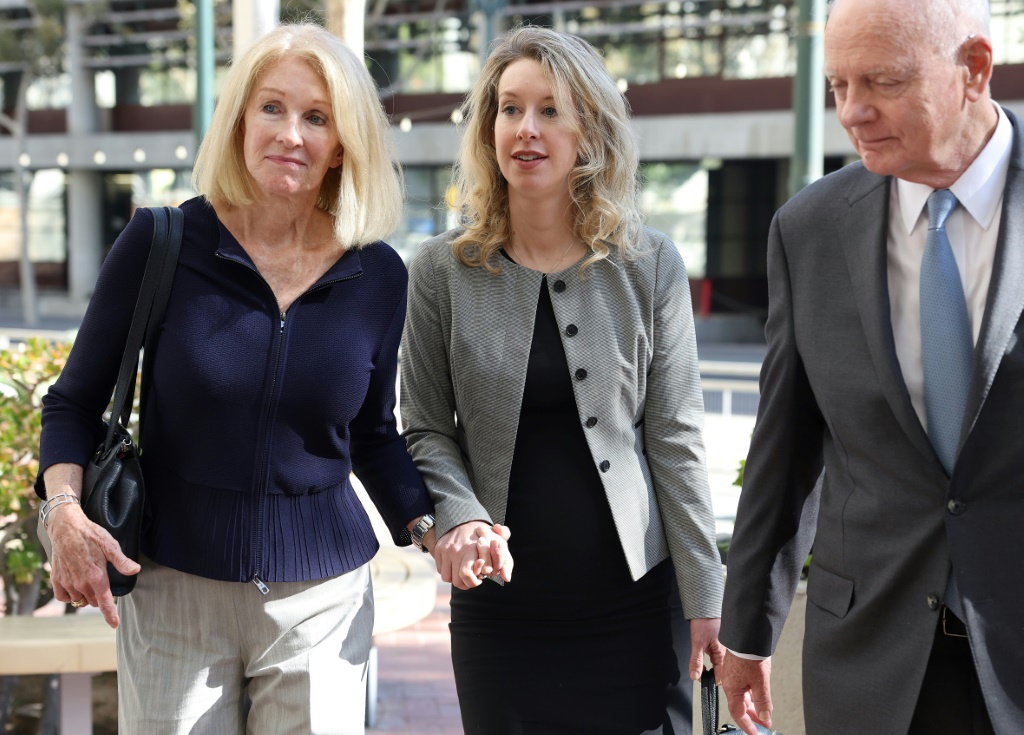 A US judge ruled against a new trial for Theranos founder Elizabeth Holmes, shown here with her parents