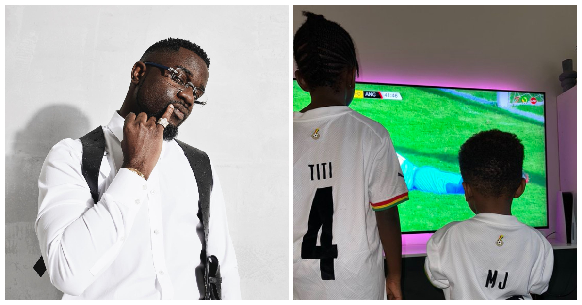 Sarkodie with Titi and MJ wearing custom-made jerseys watching Ghana match