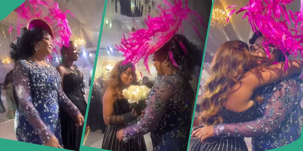 Veekee James gives wedding bouquet to her mother.