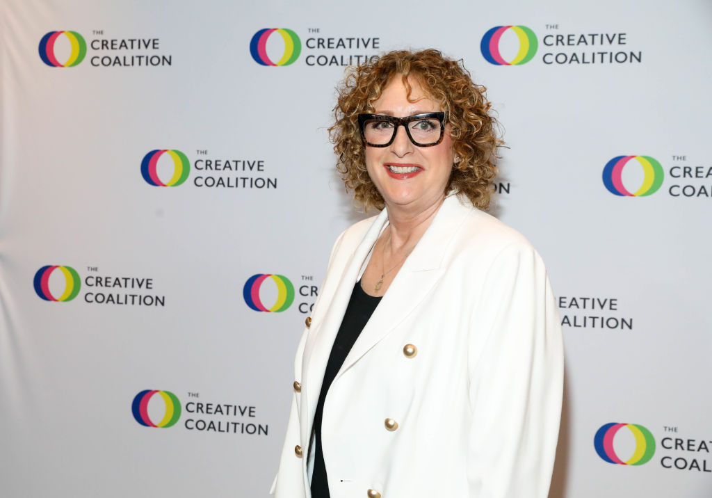 Judy Gold in a white blazer as she attends #RightToBearArts Gala