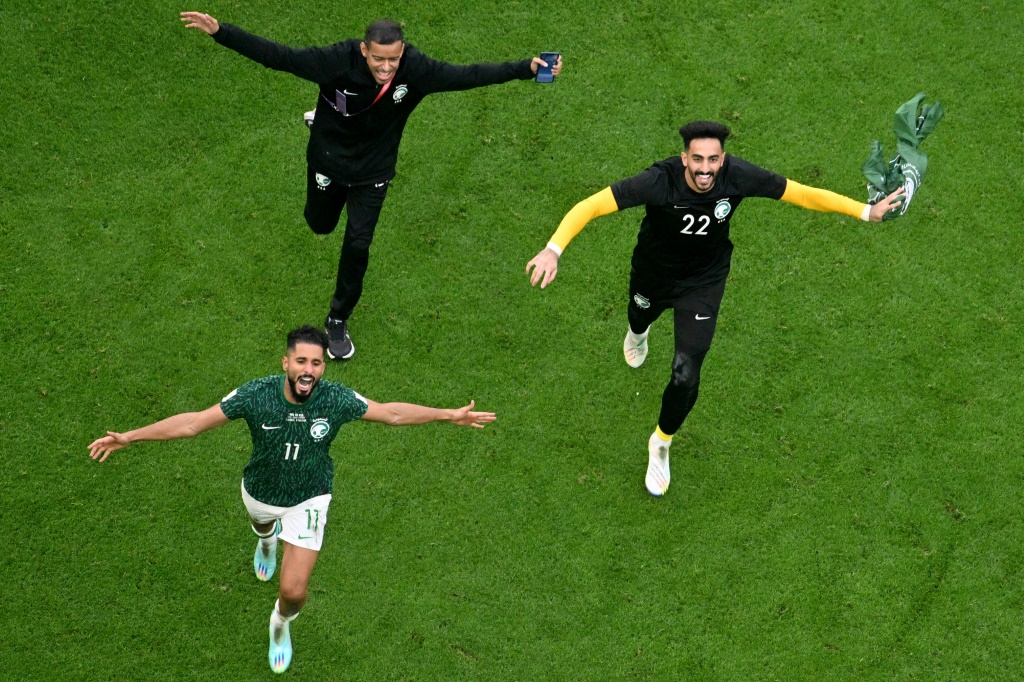 Saudi Arabia's players celebrate their shock World Cup win over Argentina