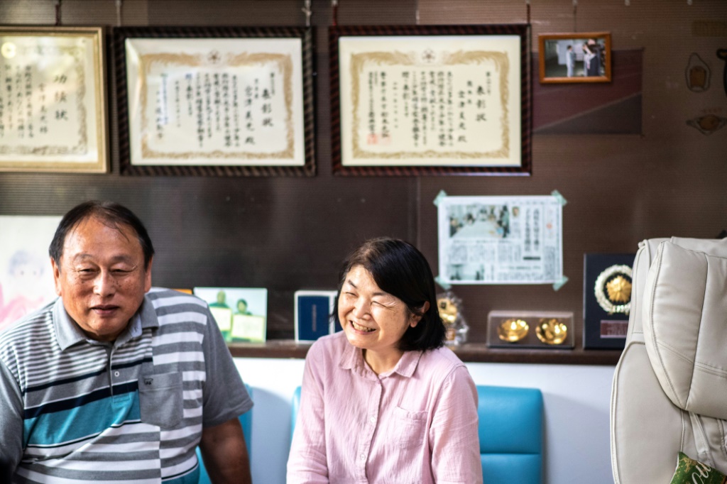 Yoshimitsu (L) and Midori Miyatsu, the adoptive parents of Koichi Miyatsu, have fostered more than 30 children