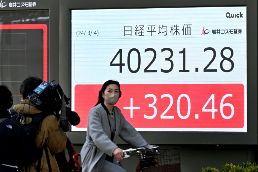 Japan's benchmark Nikkei 225 index surpassed the 40,000 mark for the first time, with analysts predicting it could advance even further