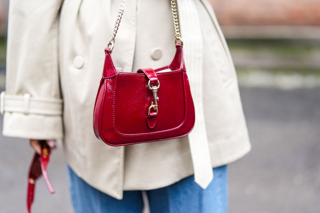 Stylish red Gucci handbag featuring iconic branding.