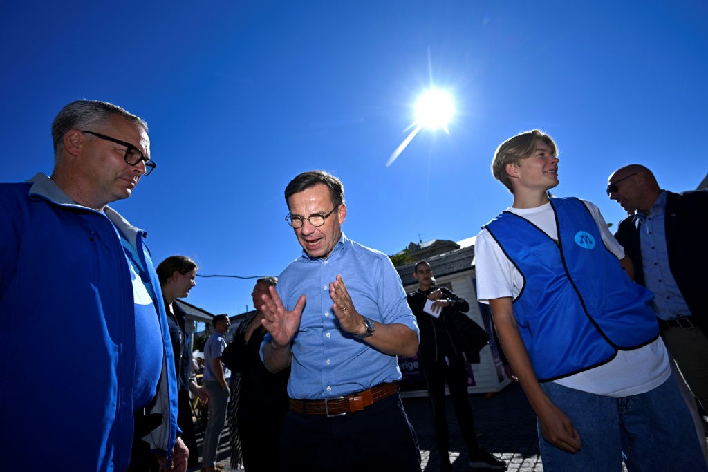 Swedish Moderate Party leader Ulf Kristersson (C) during a campaign visit to Kristianstad