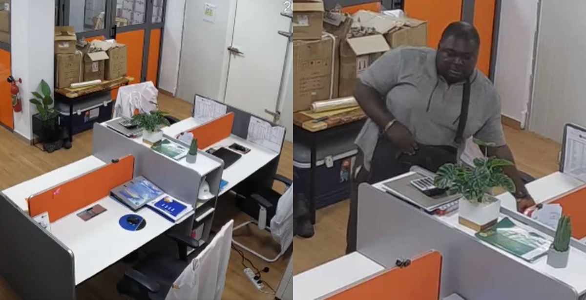 Man stealing laptops from the office