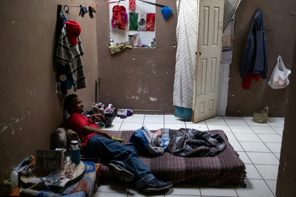 A man rests in a room for homeless people with drug use problems, in Mexicali, Mexico, in May 2023
