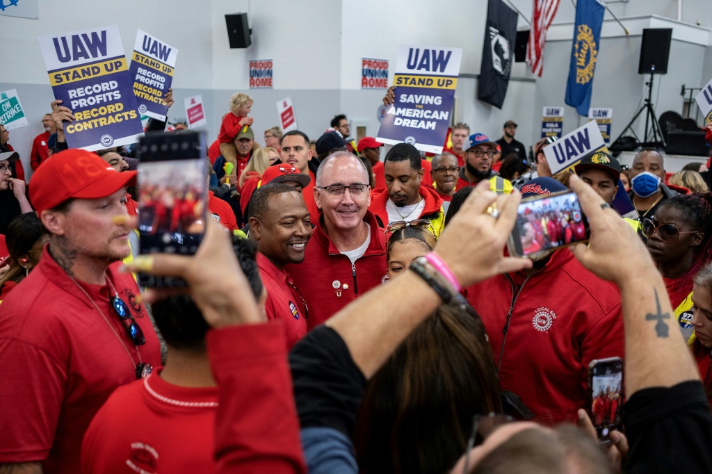 UAW President Shawn Fain, shown at a Chicago rally earlier this month, hailed a tentative agreement with Ford as an historic win